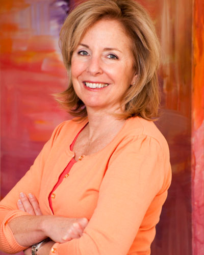 a woman wearing an orange blouse